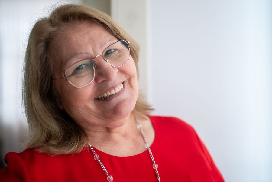 Older neighbor smiling at home