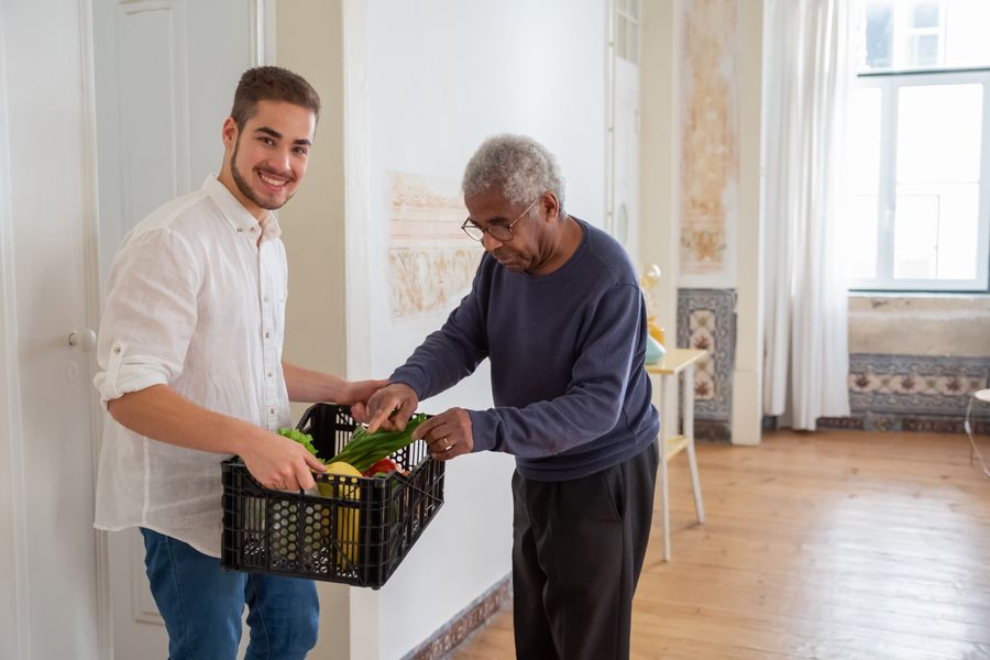 Teen worker dropping off groceries for a neighbor